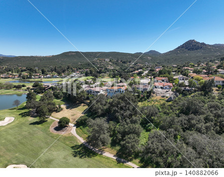 Aerial view of Ramona neighborhood with mountain, valley and golf course Aerial view of Ramona neighborhood with mountain, valley and golf course 140882066