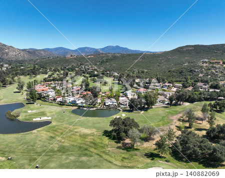 Aerial view of Ramona neighborhood with mountain, valley and golf course 140882069