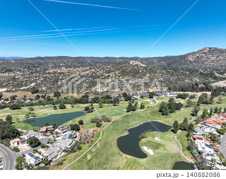 Aerial view of Ramona neighborhood with mountain, valley and golf course Aerial view of Ramona neighborhood with mountain, valley and golf course 140882086