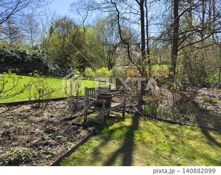 Enlgish green garden with multpiple type of trees and plants Enlgish green garden with multpiple type of trees and plants 140882099