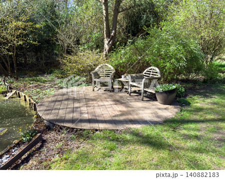 Enlgish green garden with multpiple type of trees and plants 140882183