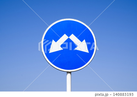 The sign of the crossing. Road signs. Sign on a blue background The sign of the crossing. Road signs. Sign on a blue background 140883193
