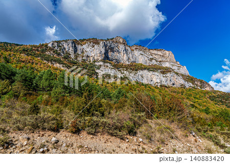 Driving through the Valley of Hecho in the Spanish Pyrenees in autumn, Spain 140883420