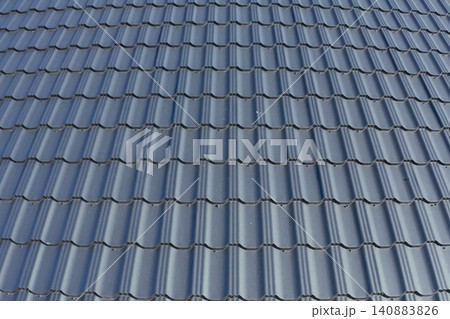 Corrugated metal roof and metal roofing. Modern roof made of metal. Corrugated metal roof and metal roofing. Modern roof made of metal. 140883826