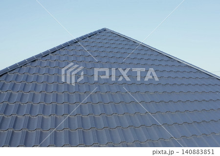 Corrugated metal roof and metal roofing. Modern roof made of metal. 140883851