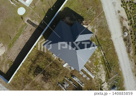 Corrugated metal roof and metal roofing. Modern roof made of metal. Corrugated metal roof and metal roofing. Modern roof made of metal. 140883859