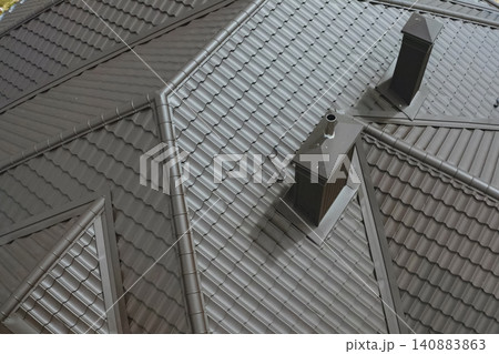 Corrugated metal roof and metal roofing. Modern roof made of metal. Corrugated metal roof and metal roofing. Modern roof made of metal. 140883863