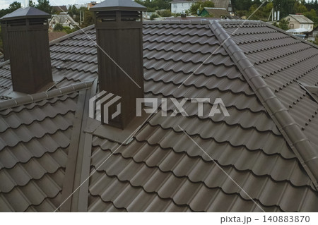 Corrugated metal roof and metal roofing. Modern roof made of metal. 140883870