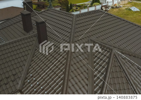 Corrugated metal roof and metal roofing. Modern roof made of metal. Corrugated metal roof and metal roofing. Modern roof made of metal. 140883875