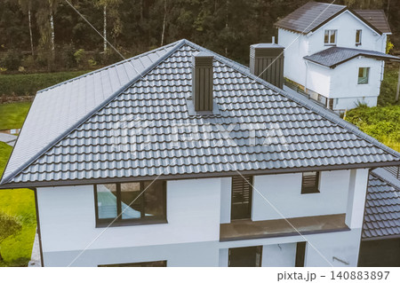 Corrugated metal roof and metal roofing. Modern roof made of metal. 140883897