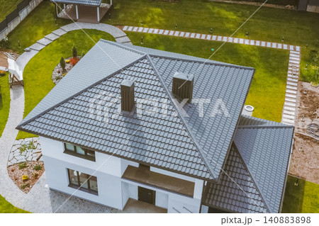 Corrugated metal roof and metal roofing. Modern roof made of metal. Corrugated metal roof and metal roofing. Modern roof made of metal. 140883898