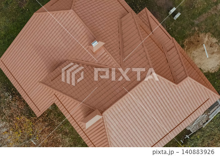 Corrugated metal roof and metal roofing. Modern roof made of metal. Corrugated metal roof and metal roofing. Modern roof made of metal. 140883926