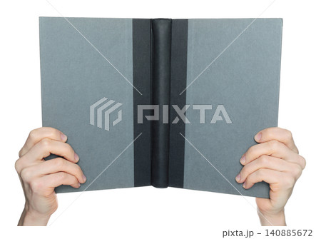 Hands holding an open book showing the blank cover, isolated on transparent background. Clean mockup template for publishing, branding, education, presentation and design 140885672