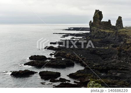 Londrangar basalt cliffs in Iceland Londrangar basalt cliffs in Iceland 140886220