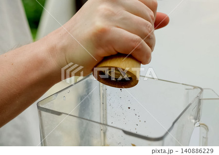 Grinding spices and shaking them in dish. Spices in food. 140886229