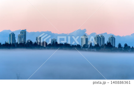 Modern City Skyscrapers Flying in the Sky. Rising Above a Dense Low Fog Modern City Skyscrapers Flying in the Sky. Rising Above a Dense Low Fog 140886361