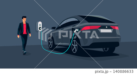 Electric Car Charging at Underground Garage on with Wall Box Charger Station Electric Car Charging at Underground Garage on with Wall Box Charger Station 140886633