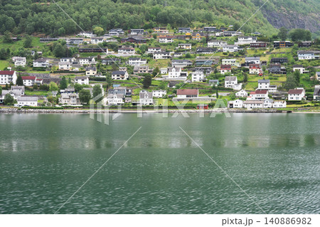 Houses in small settlements in the valleys of the magnificent Norwegian fjords Houses in small settlements in the valleys of the magnificent Norwegian fjords 140886982