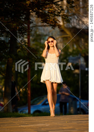 Slavic Woman Walking in Warm Golden Light Slavic Woman Walking in Warm Golden Light 140887126