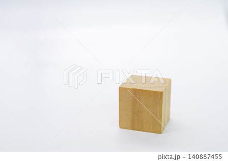 Single natural wooden cube isolated on a clean white background for minimalist product mockup and branding use. Single natural wooden cube isolated on a clean white background for minimalist product mockup and branding use. 140887455