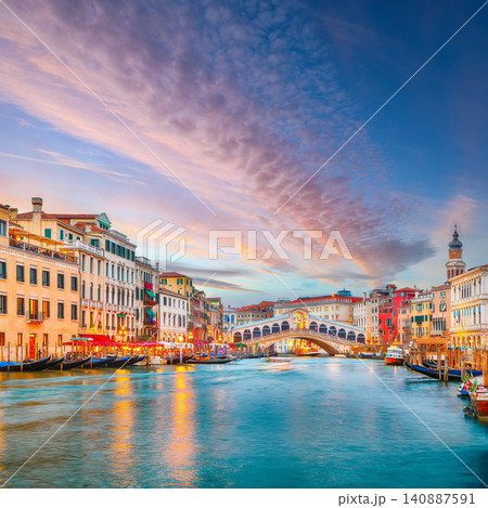 Gorgeous sunset and evening cityscape of Venice with famous Canal Grande and Rialto Bridge. Gorgeous sunset and evening cityscape of Venice with famous Canal Grande and Rialto Bridge. 140887591