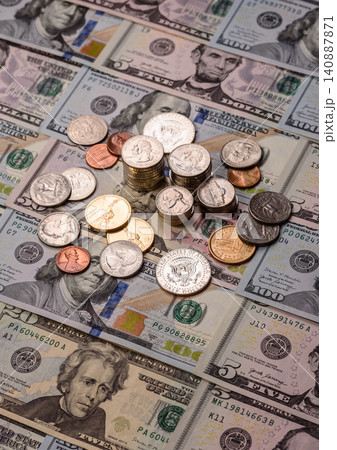 Paper US dollar bills of various denominations and cent coins as a business tool. Cash US dollars Paper US dollar bills of various denominations and cent coins as a business tool. Cash US dollars 140887871