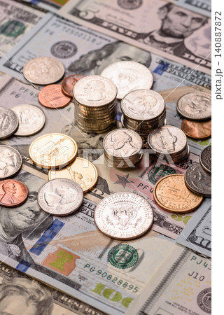 Paper US dollar bills of various denominations and cent coins as a business tool. Cash US dollars Paper US dollar bills of various denominations and cent coins as a business tool. Cash US dollars 140887872