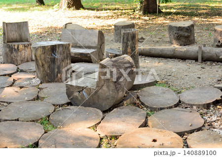 Rustic log seating area in a park Rustic log seating area in a park 140889100
