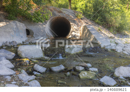 Large round sewage outlet contributing to coastal pollution Large round sewage outlet contributing to coastal pollution 140889621