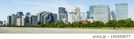 Panoramic view of the many pine trees around the Kokyo Gaien gardens, with the Marunouchi modern office building background in Chiyoda, Tokyo, Japan. Panoramic view of the many pine trees around the Kokyo Gaien gardens, with the Marunouchi modern office building background in Chiyoda, Tokyo, Japan. 140889677