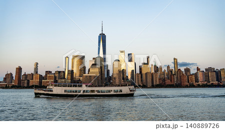 Midtown Manhattan at Hudson river. Sunset city. Cityscape in sunrise. New York downtown. Manhattan skyline. New York city. Skyscraper building of NYC. NY city architecture. Touristic destination Midtown Manhattan at Hudson river. Sunset city. Cityscape in sunrise. New York downtown. Manhattan skyline. New York city. Skyscraper building of NYC. NY city architecture. Touristic destination 140889726
