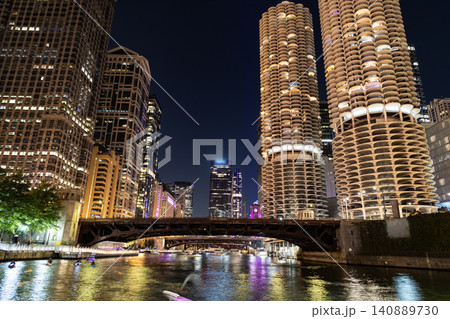 Chicago architecture of skyscraper. City night illuminated building. Skyscraper cityscape. Night city of Chicago. Business city. Night cityscape of Chicago skyscraper building. Nighttime reflection Chicago architecture of skyscraper. City night illuminated building. Skyscraper cityscape. Night city of Chicago. Business city. Night cityscape of Chicago skyscraper building. Nighttime reflection 140889730