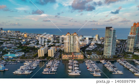 Luxury boat harbor. Marina in Miami Beach, Florida USA. Yacht boat docked on sea Biscayne bay. Downtown Miami Marina with luxury yacht boat. Summer vacation. Luxurious yacht marina Luxury boat harbor. Marina in Miami Beach, Florida USA. Yacht boat docked on sea Biscayne bay. Downtown Miami Marina with luxury yacht boat. Summer vacation. Luxurious yacht marina 140889799