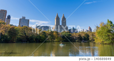 New York City, USA - October 25, 2023: Autumn landscape nature. People rowing boat in Central Park. Central Park with autumn trees. Autumn landscape. New York City Central Park with boat in lake New York City, USA - October 25, 2023: Autumn landscape nature. People rowing boat in Central Park. Central Park with autumn trees. Autumn landscape. New York City Central Park with boat in lake 140889849