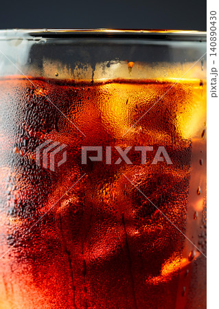 Fizz sparkling cola bubbly soda pop with ice cubes. 140890430