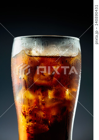 Fizz sparkling cola bubbly soda pop with ice cubes. 140890431
