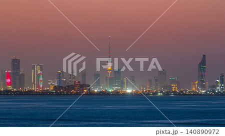 Skyline with Skyscrapers day to night timelapse in Kuwait City downtown illuminated at dusk. Kuwait City, Middle East Skyline with Skyscrapers day to night timelapse in Kuwait City downtown illuminated at dusk. Kuwait City, Middle East 140890972