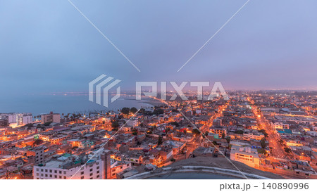 Panoramic skyline of Lima city from above with many buildings aerial night to day transition timelapse. Lima, Peru 140890996
