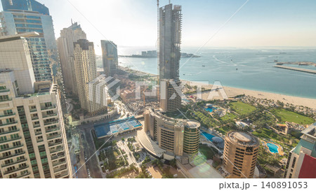 Aerial view of modern skyscrapers and beach at Jumeirah Beach Residence JBR timelapse in Dubai, UAE Aerial view of modern skyscrapers and beach at Jumeirah Beach Residence JBR timelapse in Dubai, UAE 140891053