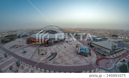 Aerial view of Aspire Zone stadium from top night to day timelapse in Doha Aerial view of Aspire Zone stadium from top night to day timelapse in Doha 140891075