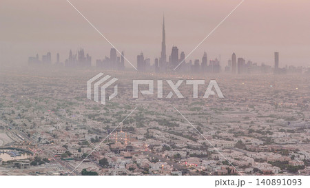 Skyline view of Dubai from night to day transition, UAE. Timelapse Skyline view of Dubai from night to day transition, UAE. Timelapse 140891093
