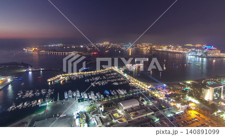 Aerial view from Dubai Marina panorama from day to night transition timelapse Aerial view from Dubai Marina panorama from day to night transition timelapse 140891099