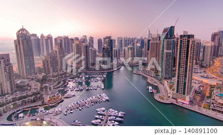 Dubai marina harbor panorama from night to day transition timelapse 140891100