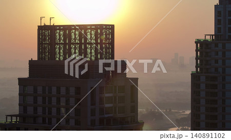 Sunrise in Dubai Marina with towers from skyscrapers rooftop, Dubai, UAE timelapse 140891102