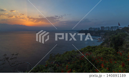 Seascape timelapse of high mountains over clear sunset sky in Turkey 140891189