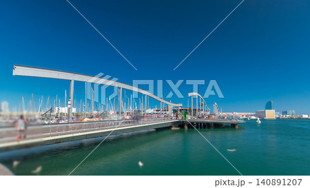 Rambla de Mar wooden walkway timelapse over Port Vell in the city of Barcelona at day in Catalonia, Spain. Rambla de Mar wooden walkway timelapse over Port Vell in the city of Barcelona at day in Catalonia, Spain. 140891207