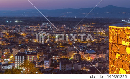 Aerial view from old castle in historical city town of Nevsehir day to night timelapse Aerial view from old castle in historical city town of Nevsehir day to night timelapse 140891226
