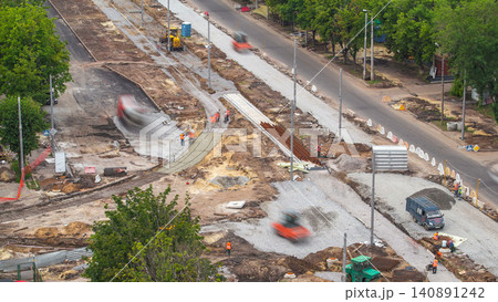 Mixer machine at concrete works for road construction with many workers timelapse Mixer machine at concrete works for road construction with many workers timelapse 140891242