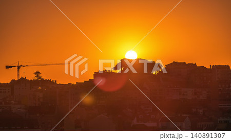Sunrise over Lisbon aerial cityscape skyline timelapse from viewpoint of St. Peter of Alcantara, Portugal. Sunrise over Lisbon aerial cityscape skyline timelapse from viewpoint of St. Peter of Alcantara, Portugal. 140891307