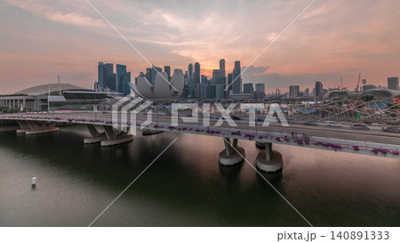 Aerial view of sunset over Helix Bridge and Bayfront Avenue with traffic timelapse at Marina Bay, Singapore Aerial view of sunset over Helix Bridge and Bayfront Avenue with traffic timelapse at Marina Bay, Singapore 140891333